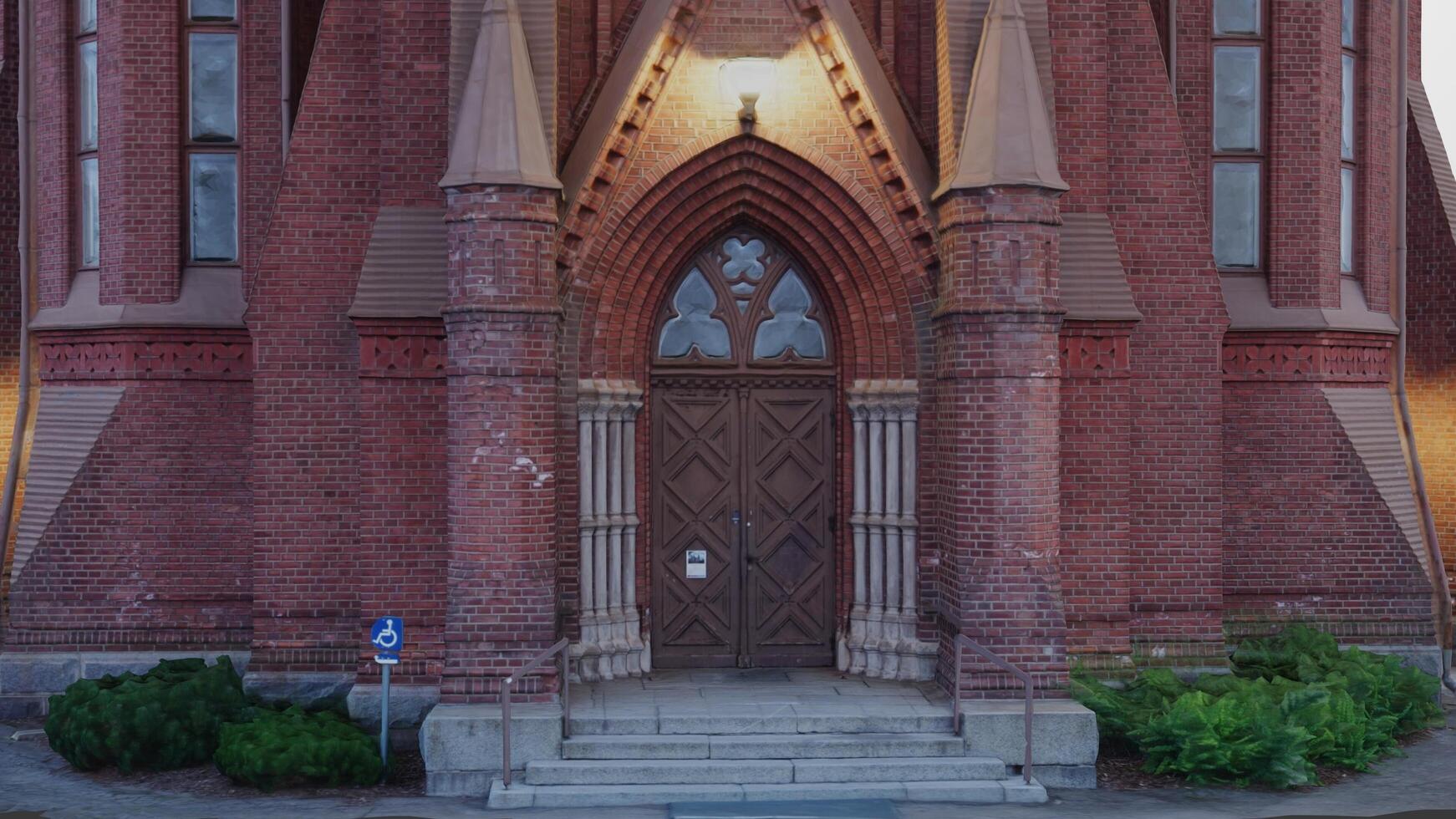 A church with a large door and a clock photo