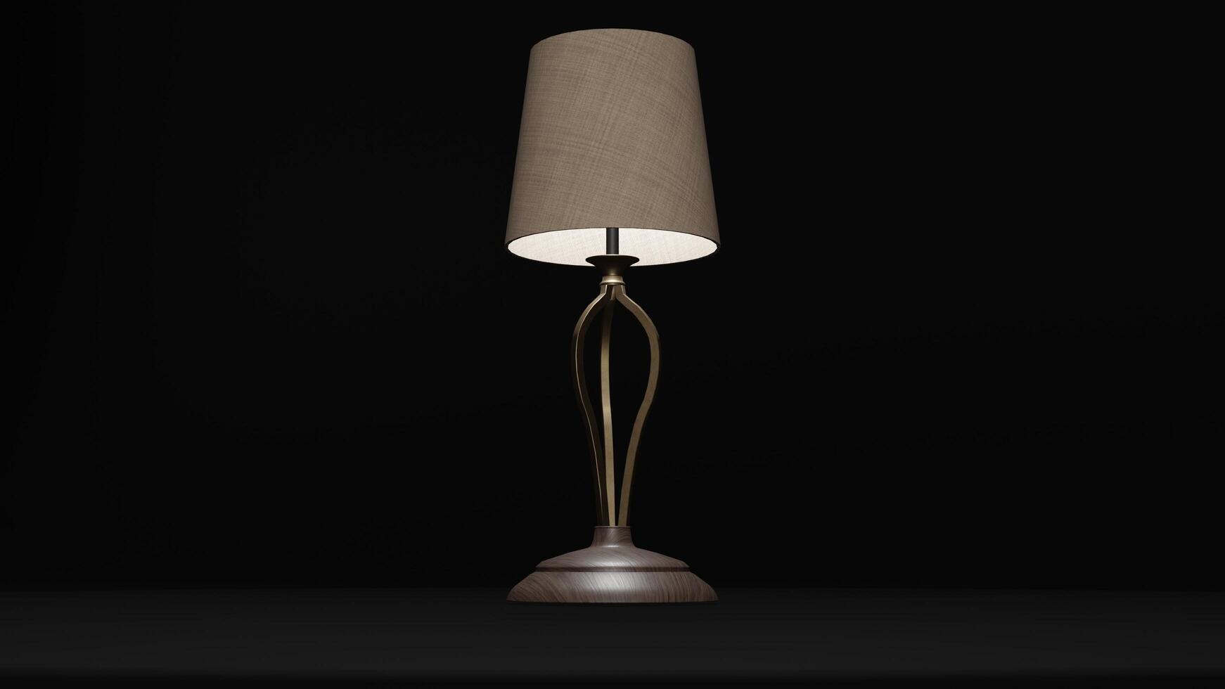 A lamp with a gold base and a shade photo