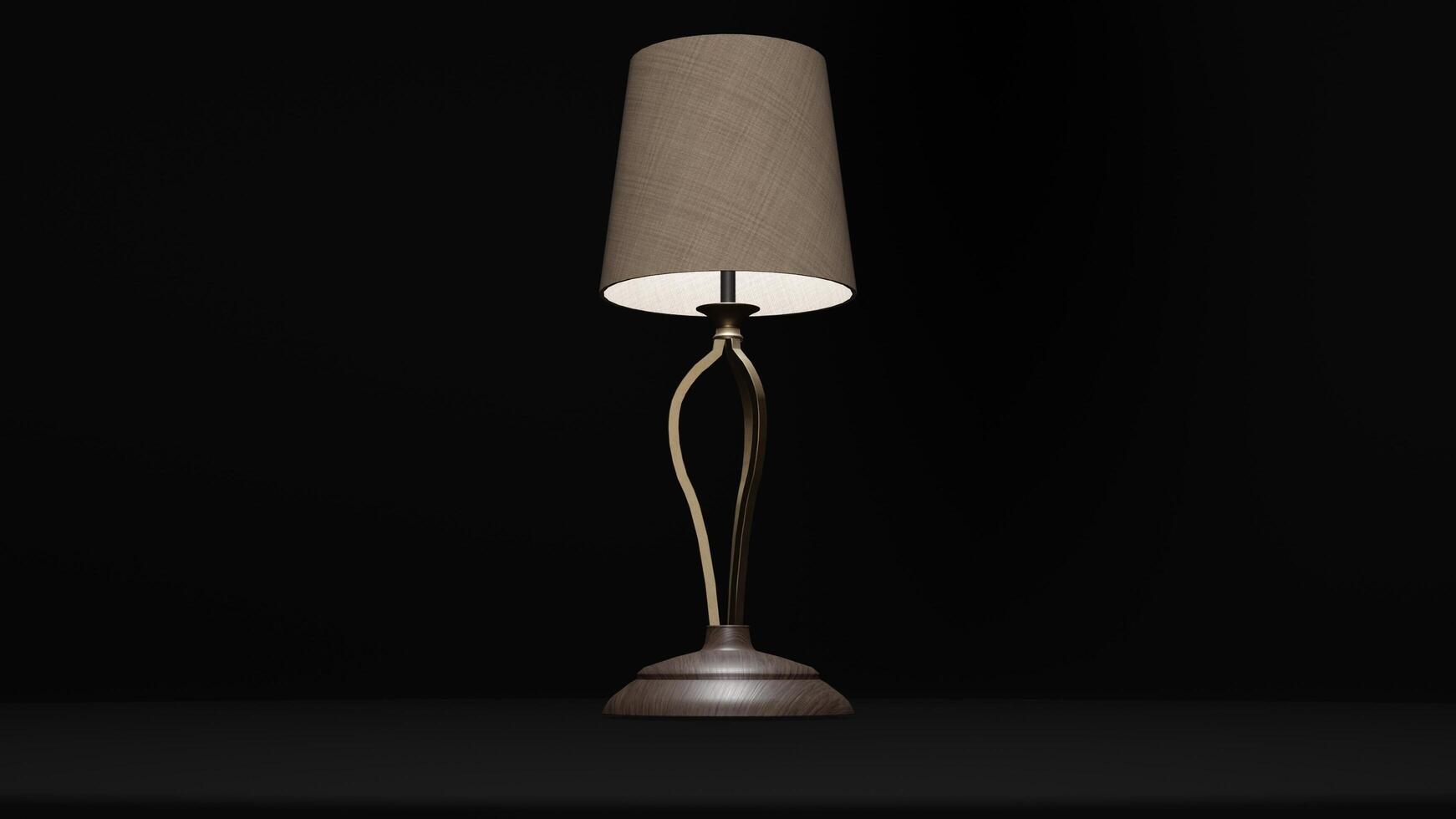 A lamp with a gold base and a shade photo