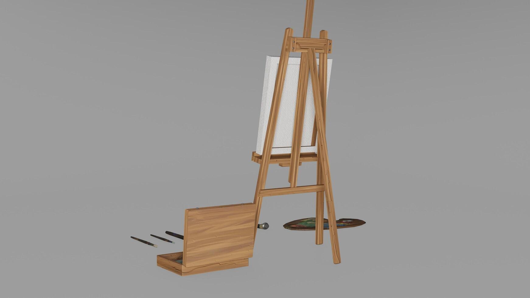 A wooden easel with a canvas and a brush photo
