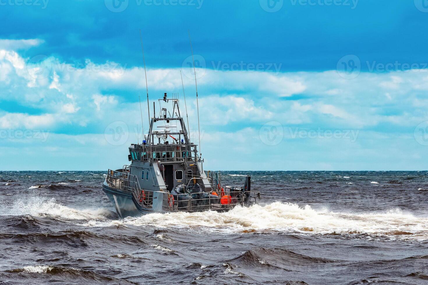 Grey military ship sailing at Baltic sea. Border guard service photo