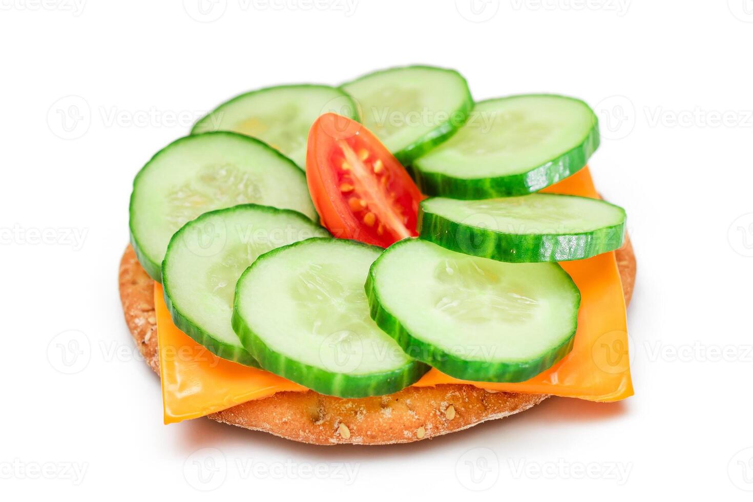 Crispy Cracker Sandwich with Fresh Cucumber, Tomato Cherry and Cheese - Isolated on White. Easy Breakfast. Quick and Healthy Sandwich. Crispbread with Tasty Filling. Healthy Dietary Snack - Isolation photo