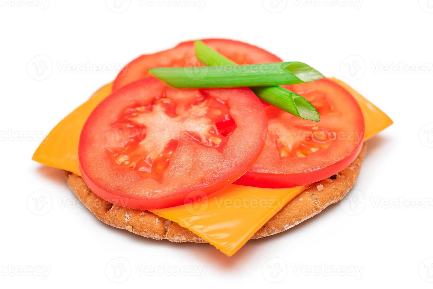 Crispy Cracker Sandwich with Tomato, Cheese and Green Onions - Isolated on White. Easy Breakfast. Quick and Healthy Sandwiches. Crispbread with Tasty Filling. Healthy Dietary Snack - Isolation photo