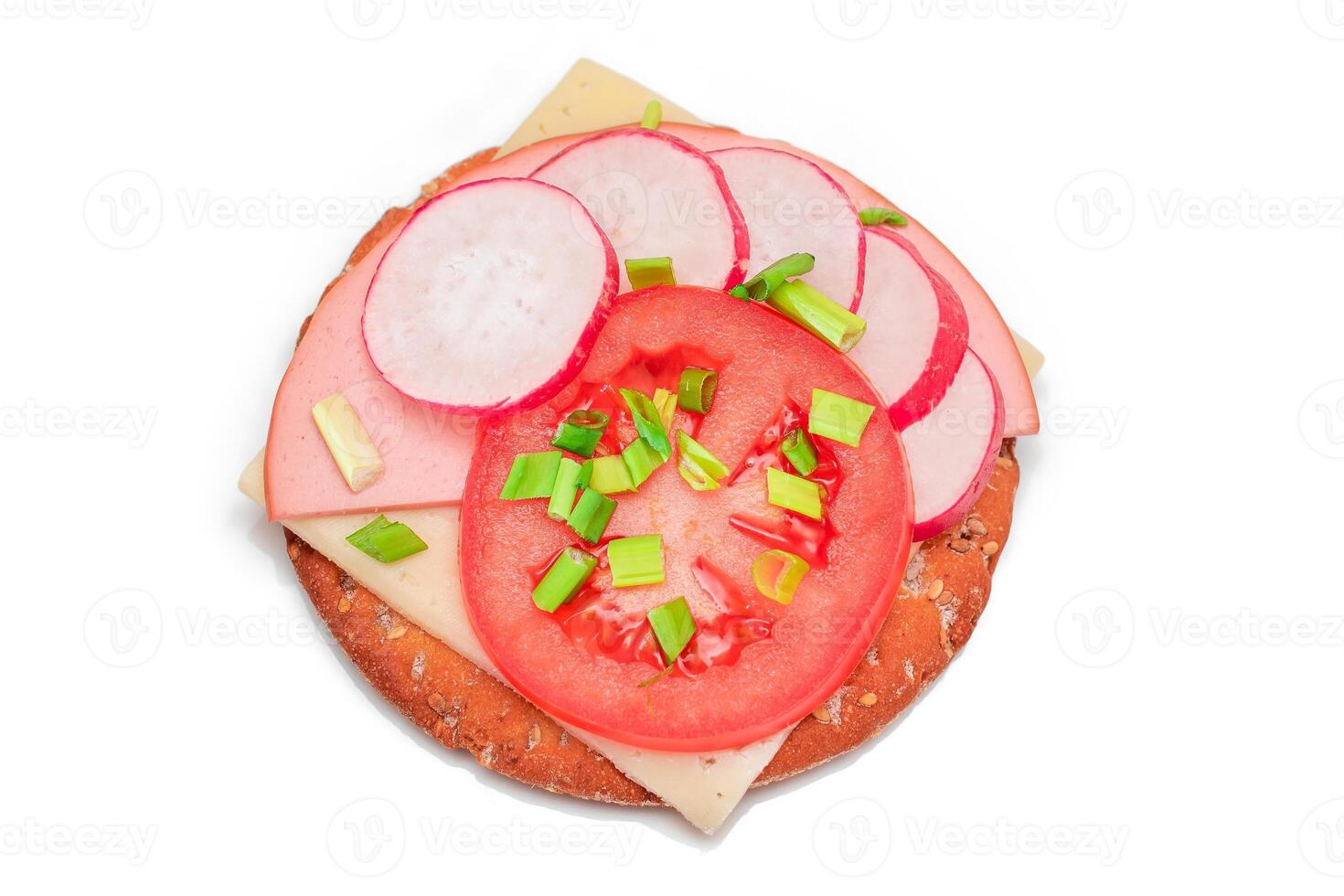 Crispy Cracker Sandwich with Tomato, Sausage, Cheese, Green Onions and Radish - Isolated on White. Easy Breakfast. Diet Food. Quick and Healthy Sandwiches. Crispbread with Tasty Filling - Isolation photo