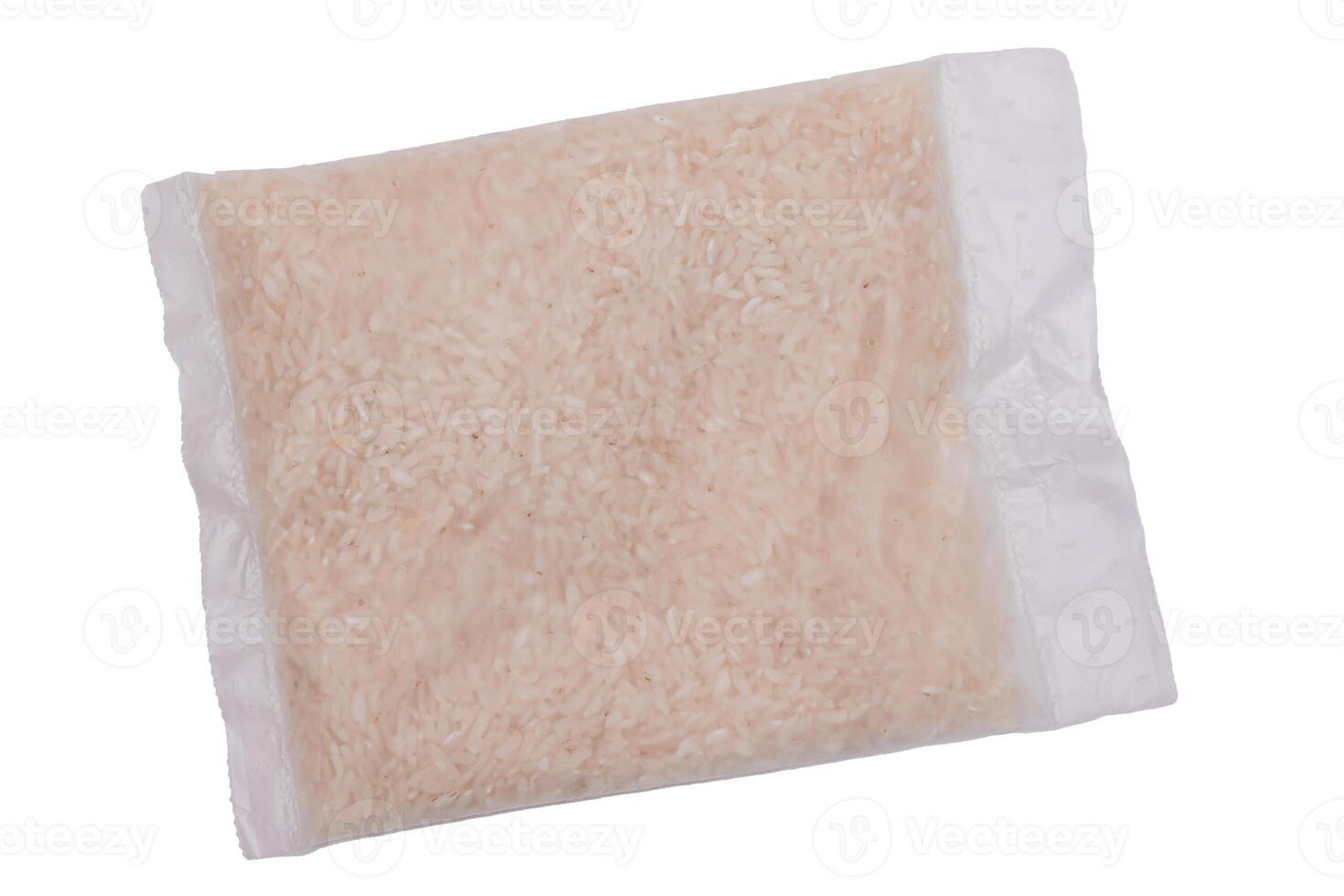 A Plastic Bag of White Long Grain Rice - Isolated on White Background. Small Transparent Package with Dry Rice - Isolation photo