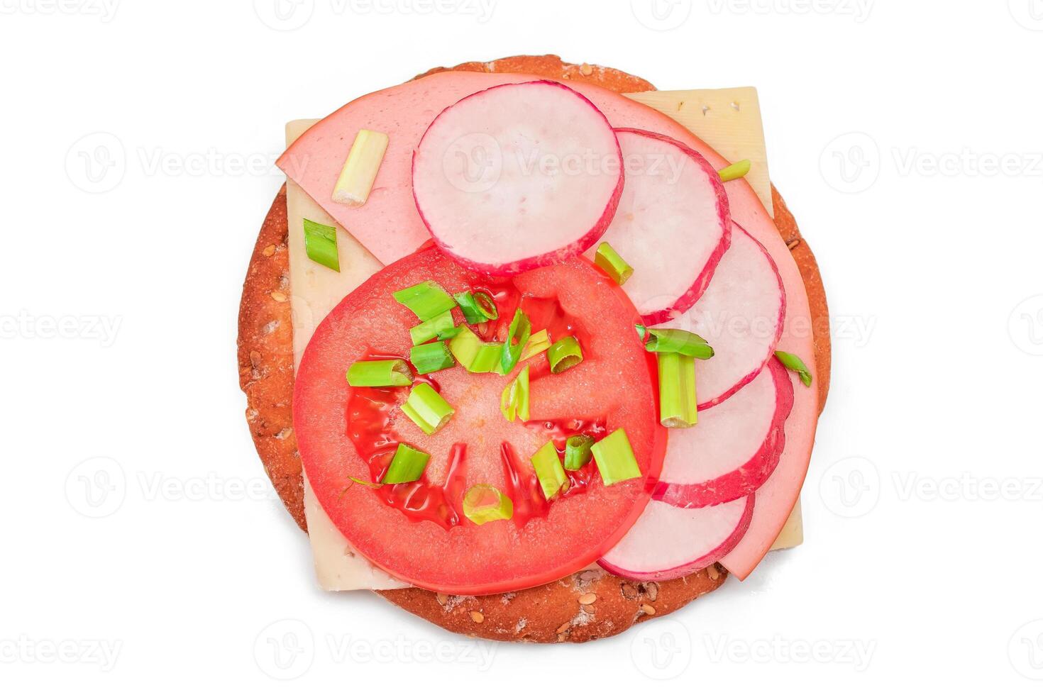 Crispy Cracker Sandwich with Tomato, Sausage, Cheese, Green Onions and Radish - Isolated on White. Easy Breakfast. Diet Food. Quick and Healthy Sandwiches. Crispbread with Tasty Filling - Isolation photo