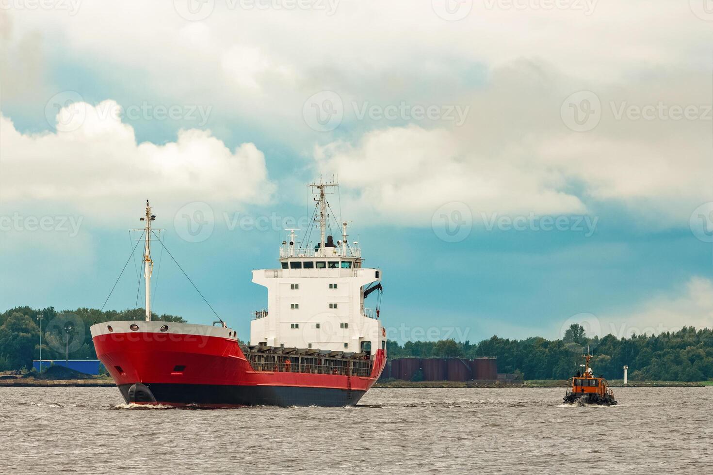 Red new cargo ship moving abroad. Product export in Europe photo