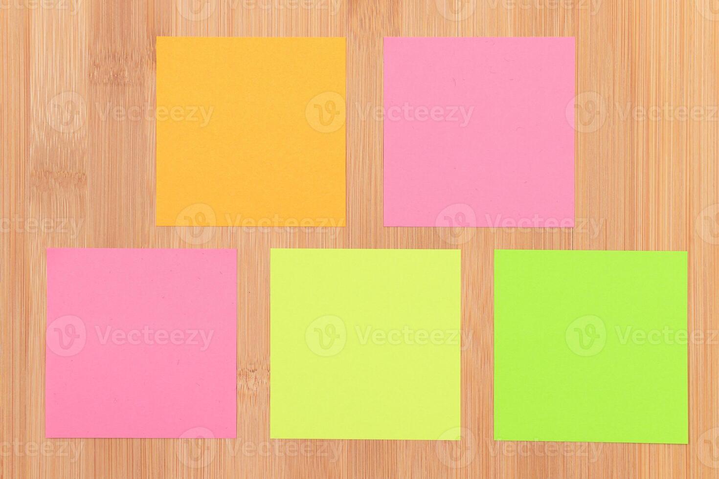 Colored Sticky Notes with Copyspace Pinned to the Wooden Message Board. To Do List Reminder in Office. Blank Memo Sticker at Work - Template. Empty Checklist - Mockup photo
