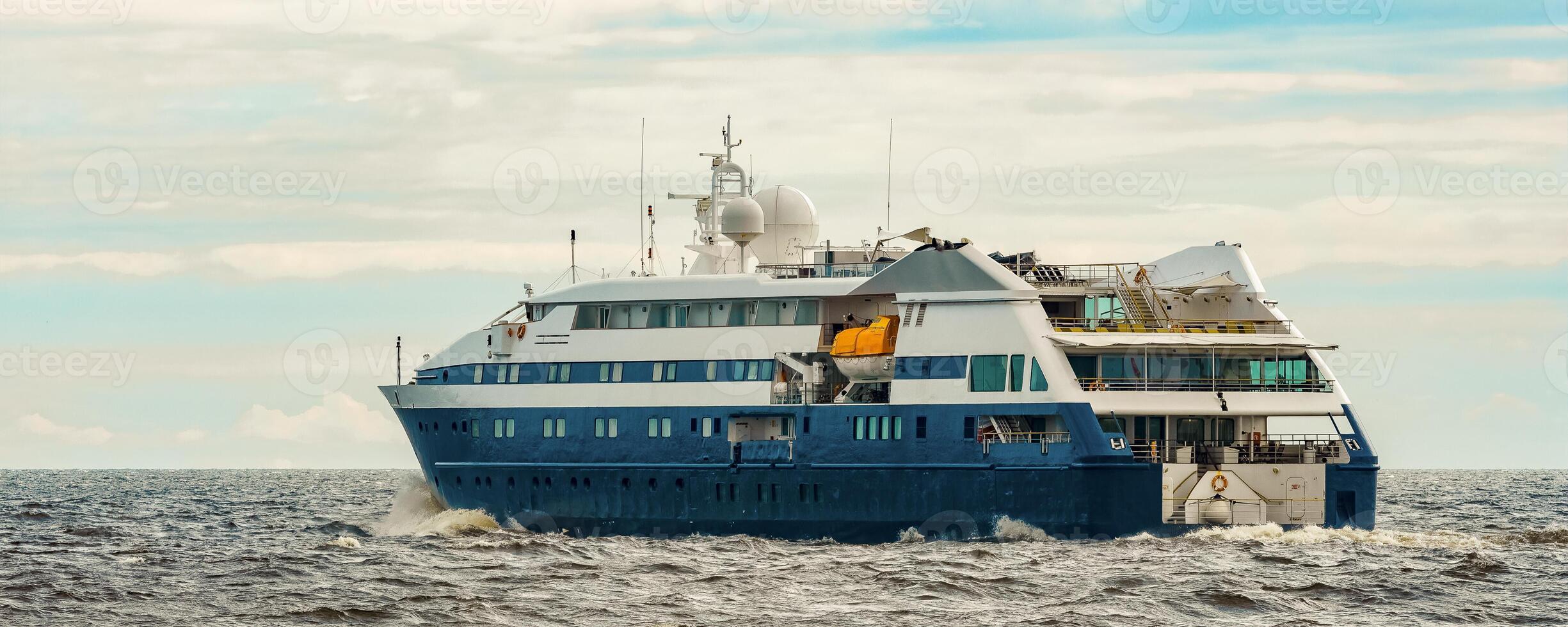 Small blue passenger ship sailing in Baltic sea. Spa services photo