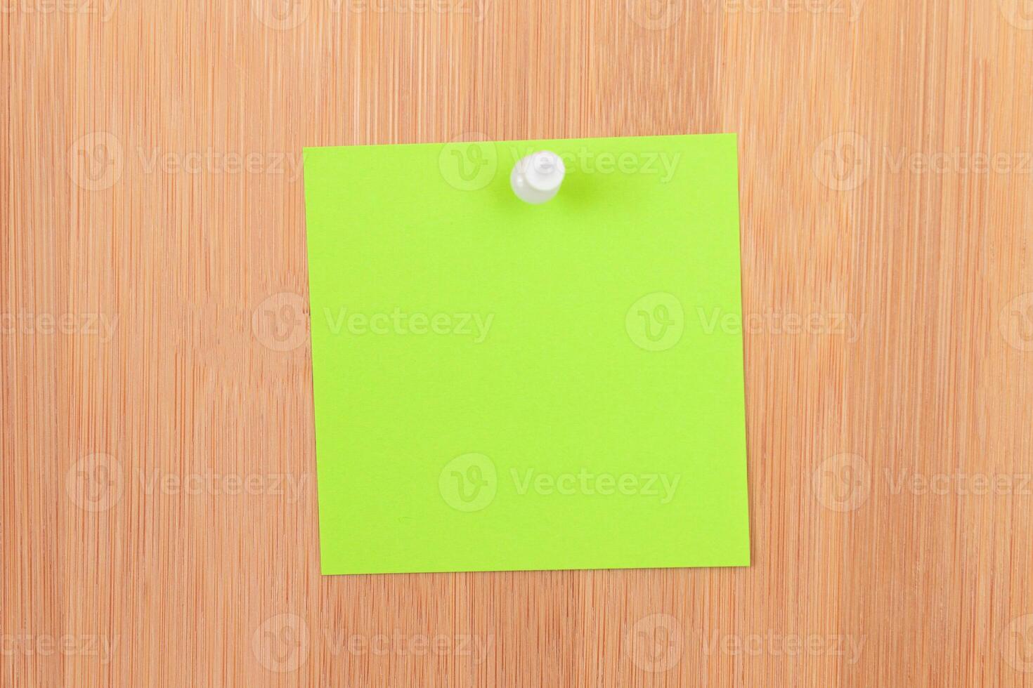 Green Sticky Note Pinned to the Wooden Message Board. To Do List Reminder in Office. Blank Memo Sticker at Work - Template. Empty Checklist - Mockup photo