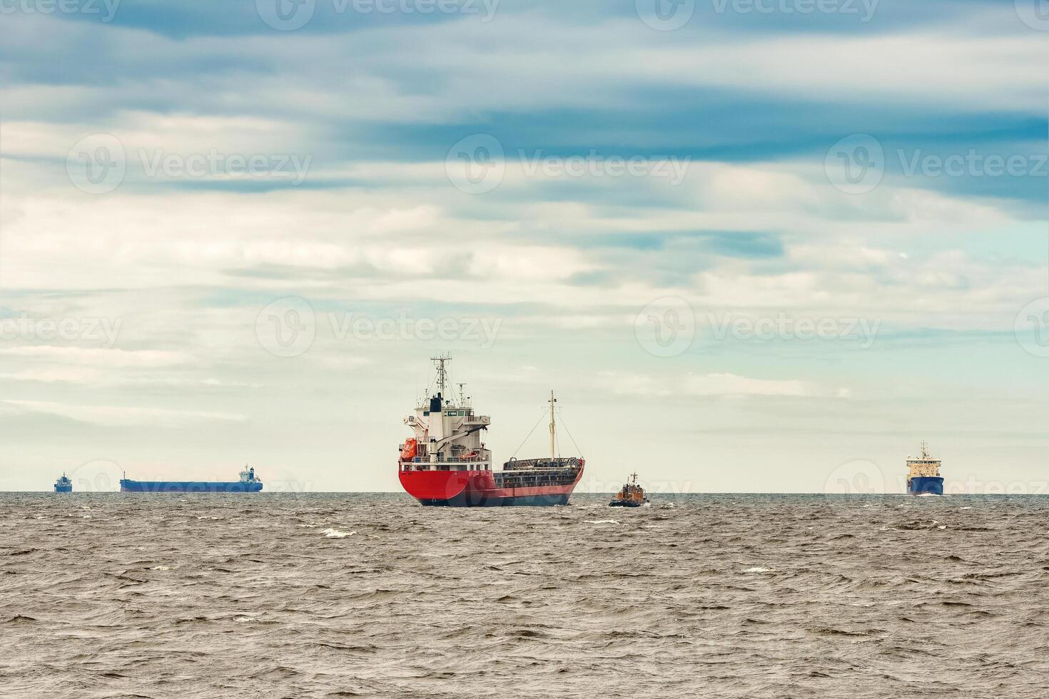 Red new cargo ship moving abroad. Product export in Europe photo