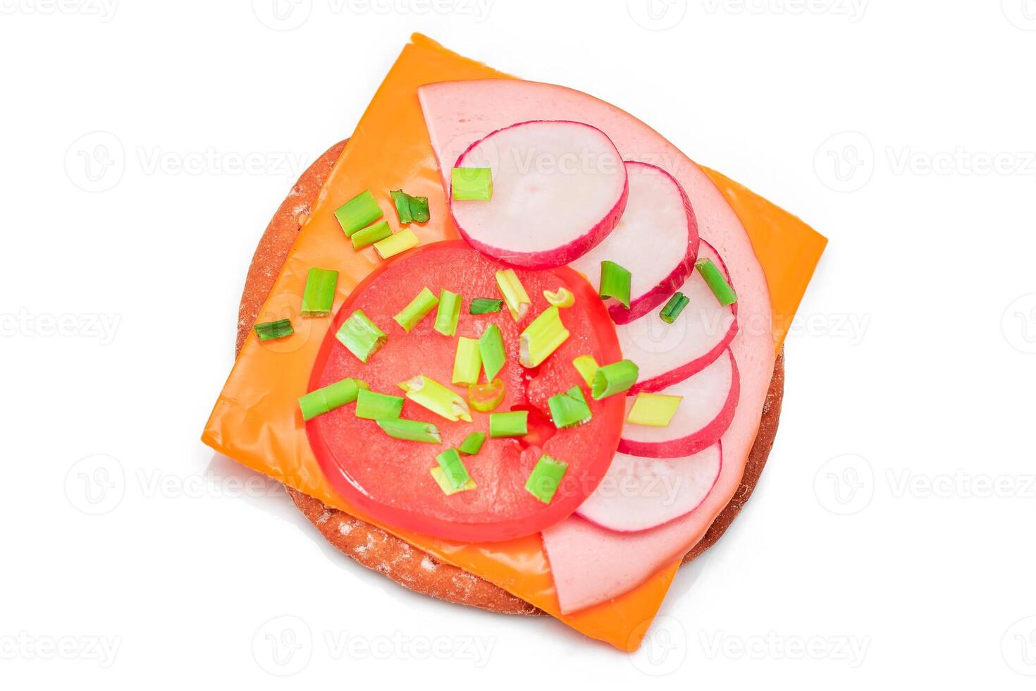 Crispy Cracker Sandwich with Tomato, Sausage, Cheese, Green Onions and Radish - Isolated on White. Easy Breakfast. Diet Food. Quick and Healthy Sandwiches. Crispbread with Tasty Filling - Isolation photo
