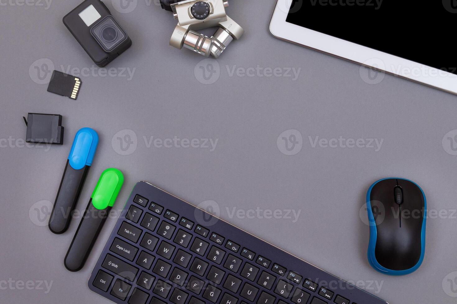 Top View of Blogger's Workplace. Digital Gadgets Lying on Grey Table - Flat Lay photo