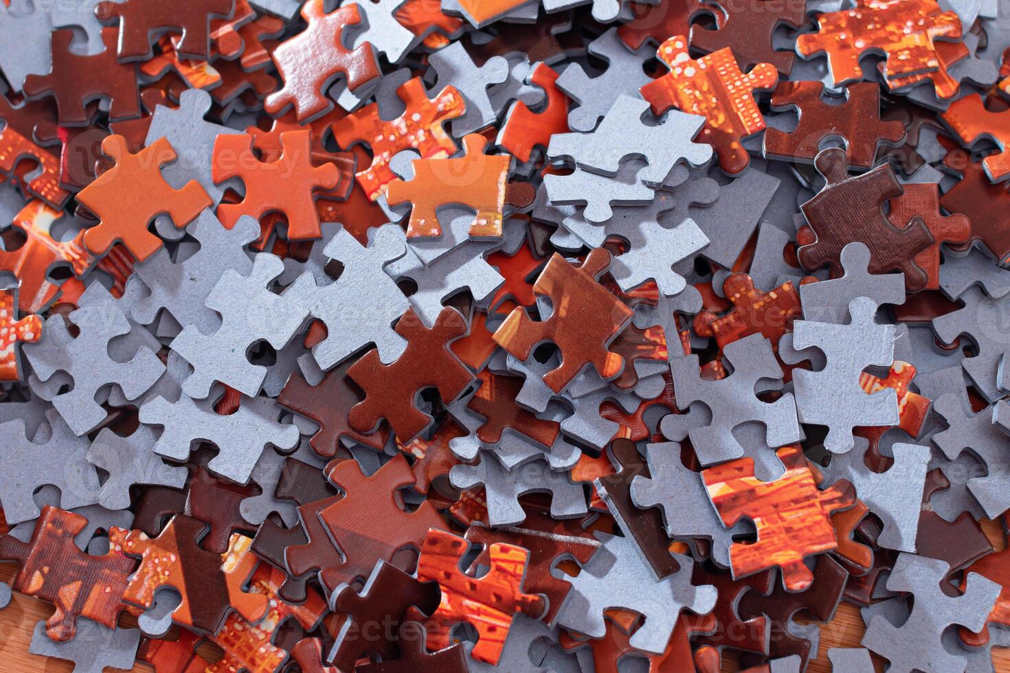 Top View of Mixed Pieces of a Jigsaw Puzzle - Texture Background photo