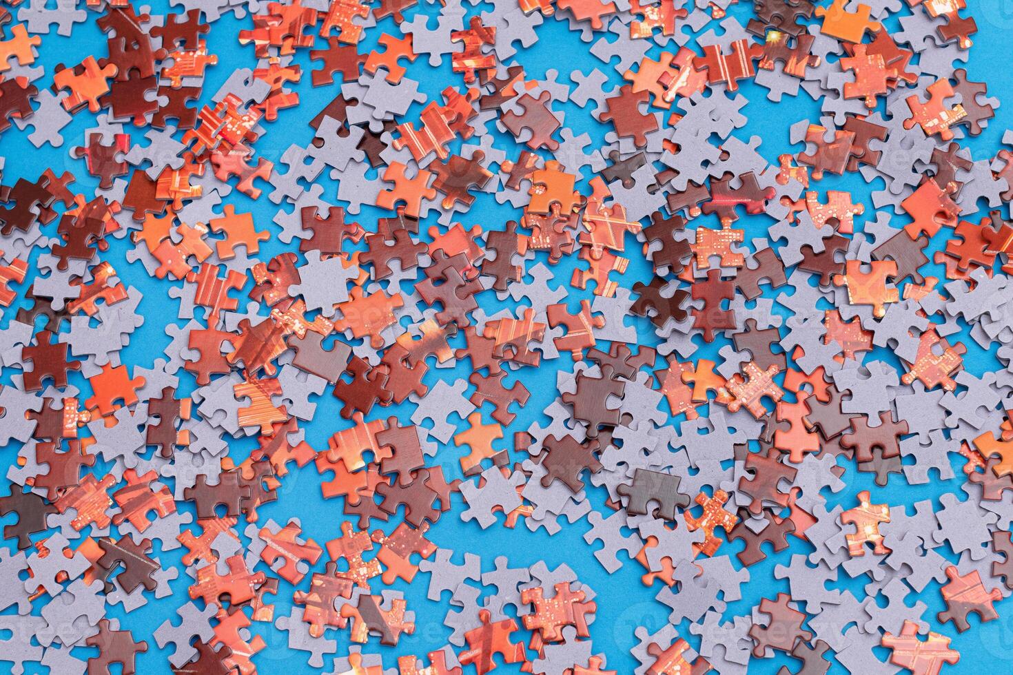 Top View of Mixed Pieces of a Jigsaw Puzzle - Texture Background photo