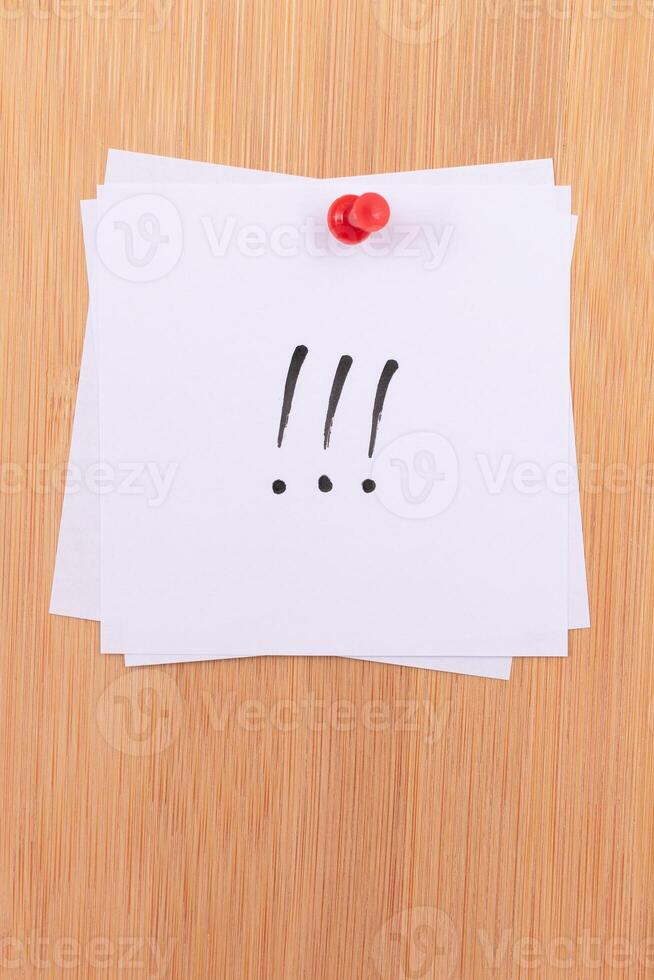 White Sticky Notes with Three Exclamation Points Pinned to the Wooden Message Board. To Do List Reminder in the Office. Memo Note at Work photo