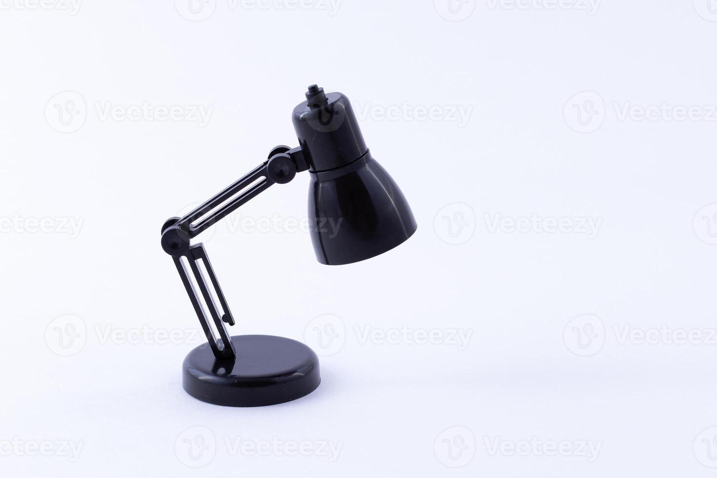 Table Lamp Mini Model. Small Black Desk Lamp on White Background photo
