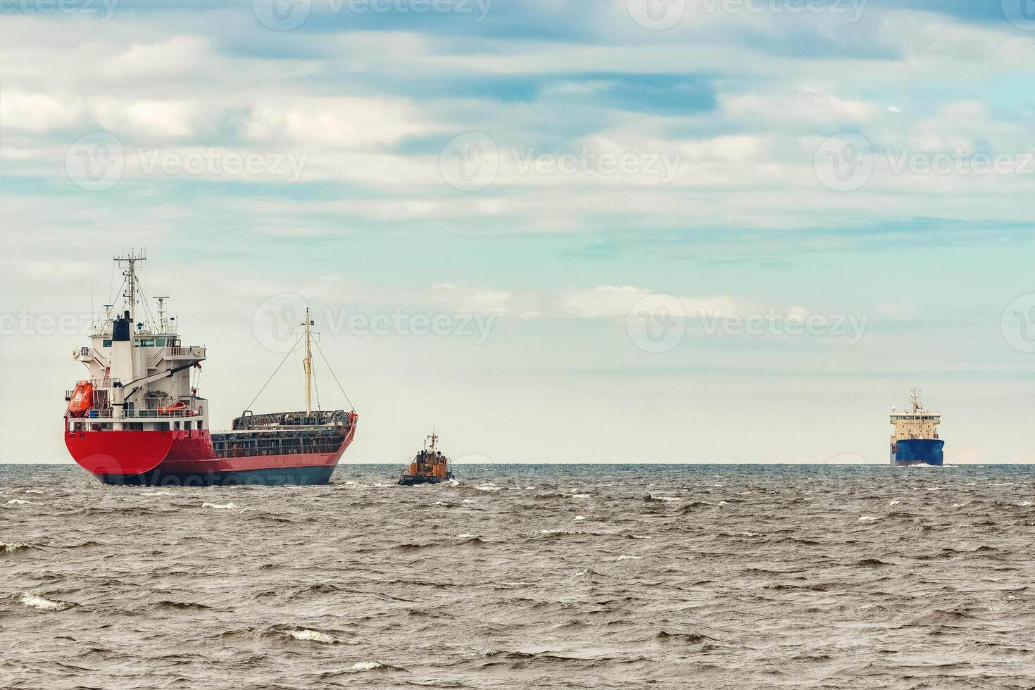 Red new cargo ship moving abroad. Product export in Europe photo