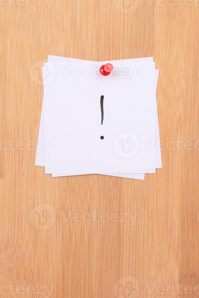 White Sticky Notes with Exclamation Point Pinned to the Wooden Message Board. To Do List Reminder in the Office. Memo Note at Work photo