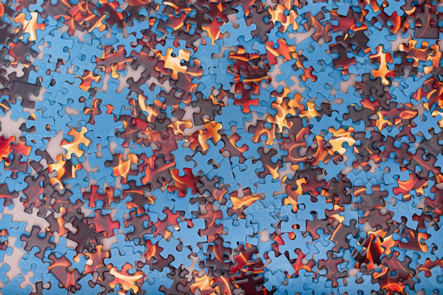 Top View of Mixed Pieces of a Jigsaw Puzzle - Texture Background photo