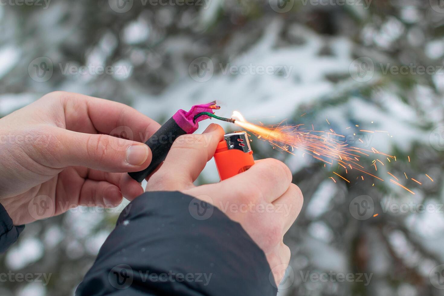 Guy Sets Fire to the Flash Noise Firecracker Outdoors in Winter at Daytime. Loud and Dangerous New Year's Entertainment. Hooliganism with Pyrotechnics. Noise of Petards in Public Places photo