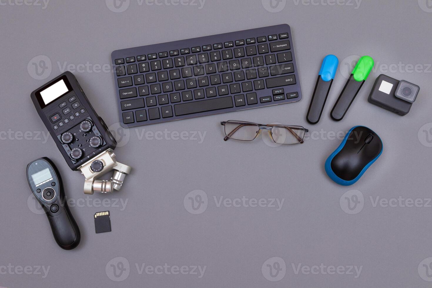 Top View of Blogger's Workplace. Digital Gadgets Lying on Grey Table - Flat Lay photo
