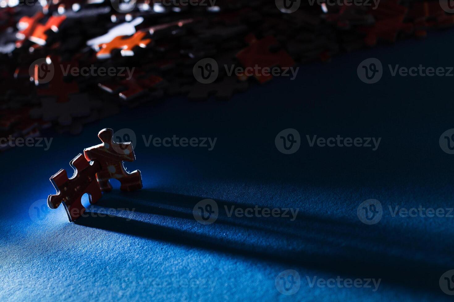 Mixed Pieces of a Colorful Jigsaw Puzzle Lie on the Blue Background - Strategy and Solving Problem Concept photo