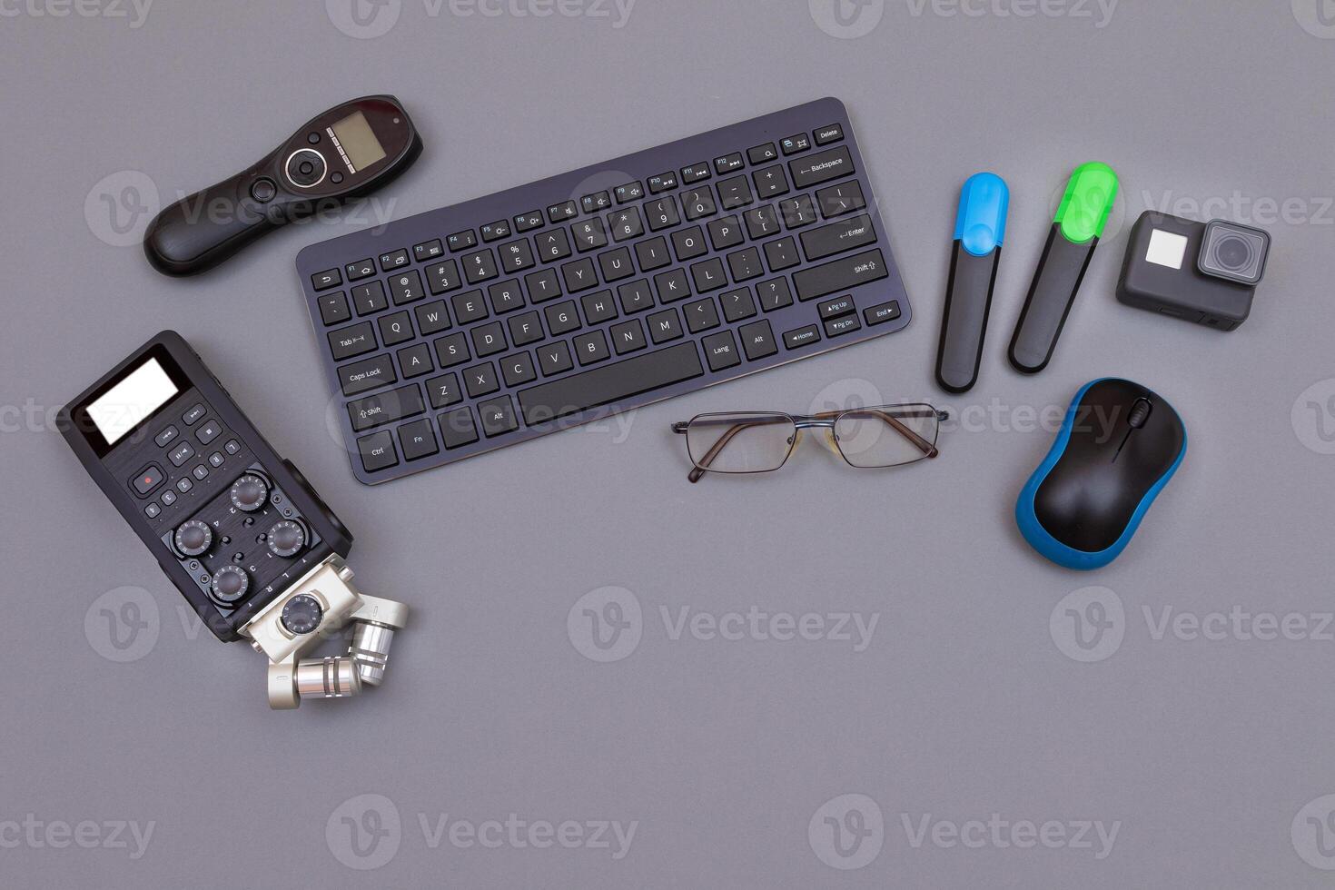 Top View of Blogger's Workplace. Digital Gadgets Lying on Grey Table - Flat Lay photo