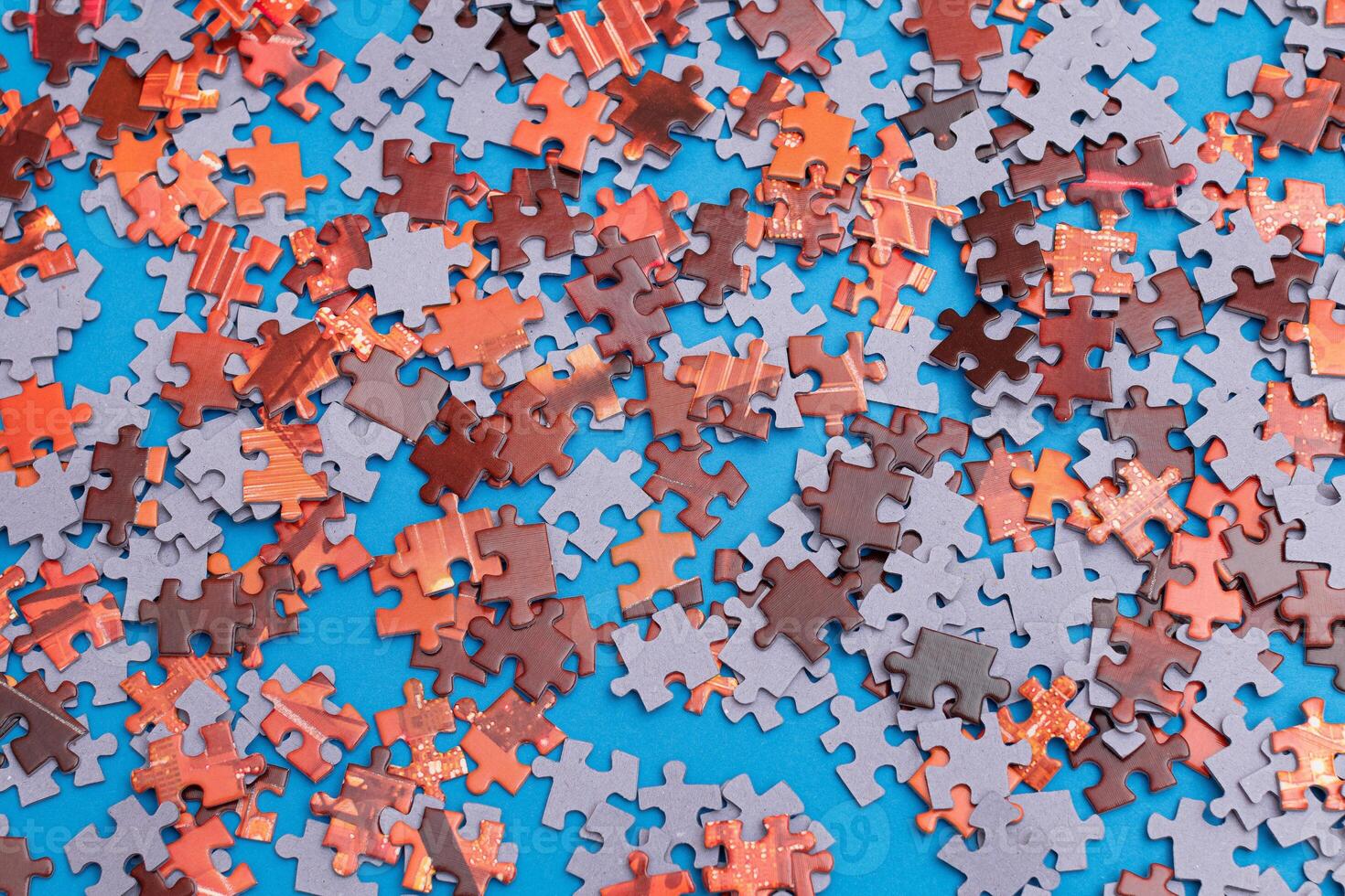 Top View of Mixed Pieces of a Jigsaw Puzzle - Texture Background photo