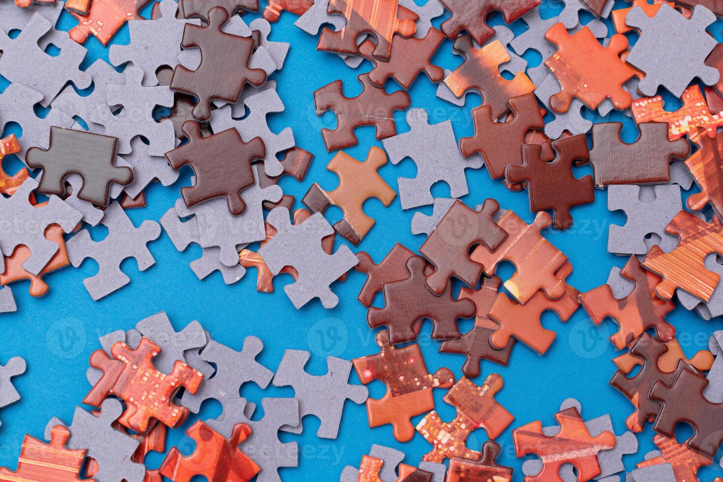 Top View of Mixed Pieces of a Jigsaw Puzzle - Texture Background photo