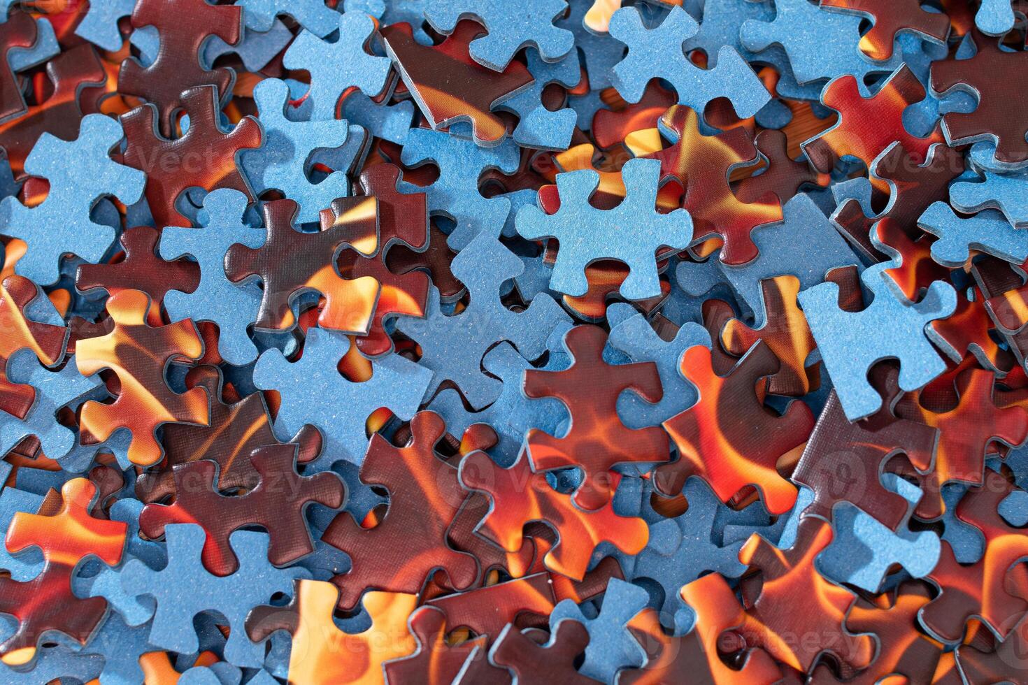 Top View of Mixed Pieces of a Jigsaw Puzzle - Texture Background photo