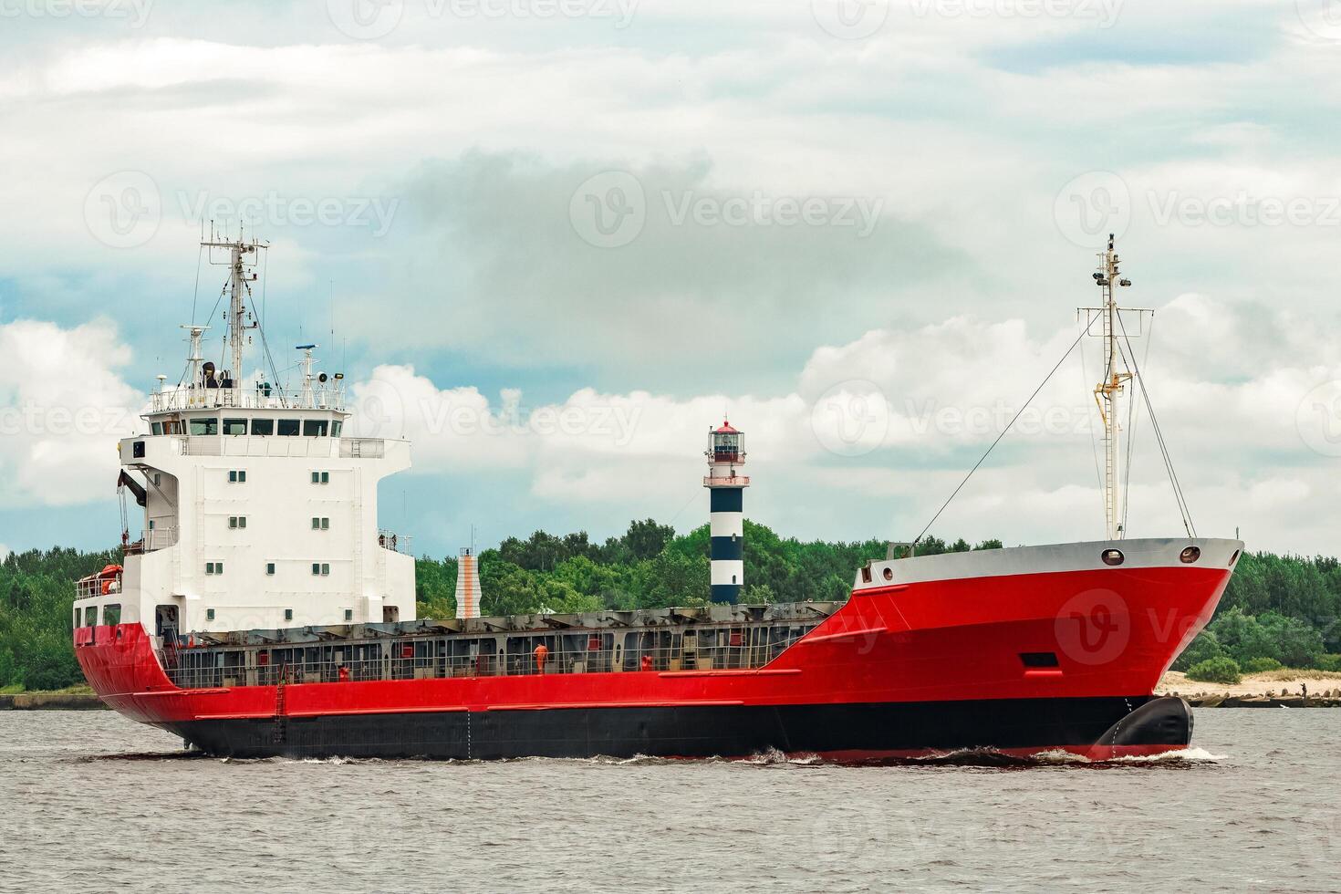 Red new cargo ship moving abroad. Product export in Europe photo