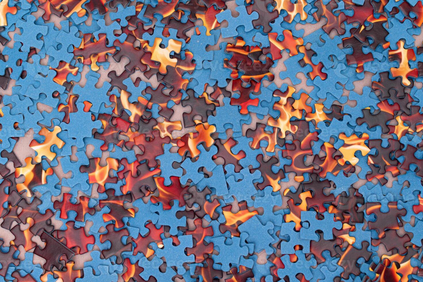 Top View of Mixed Pieces of a Jigsaw Puzzle - Texture Background photo