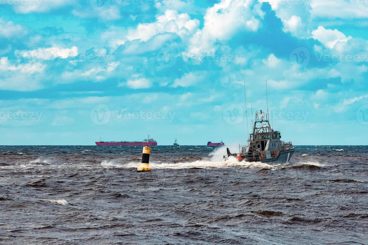 Grey military ship sailing at Baltic sea. Border guard service photo