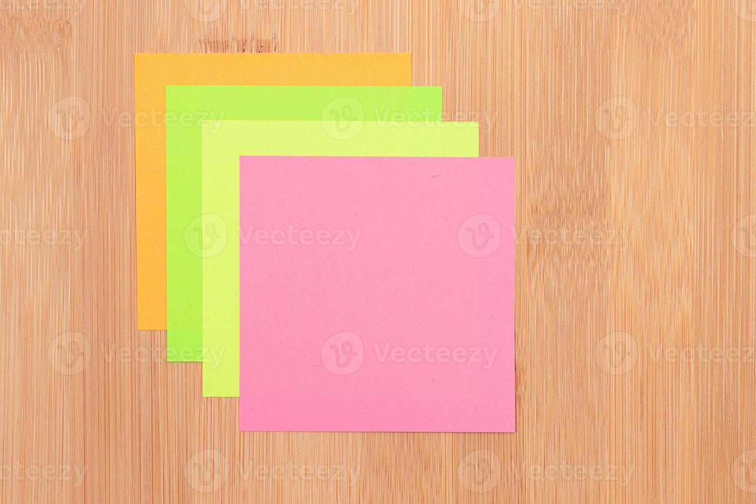 Colored Sticky Notes with Copyspace Pinned to the Wooden Message Board. To Do List Reminder in Office. Blank Memo Sticker at Work - Template. Empty Checklist - Mockup photo