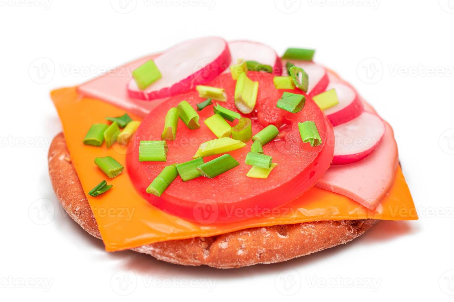 Crispy Cracker Sandwich with Tomato, Sausage, Cheese, Green Onions and Radish - Isolated on White. Easy Breakfast. Diet Food. Quick and Healthy Sandwiches. Crispbread with Tasty Filling - Isolation photo