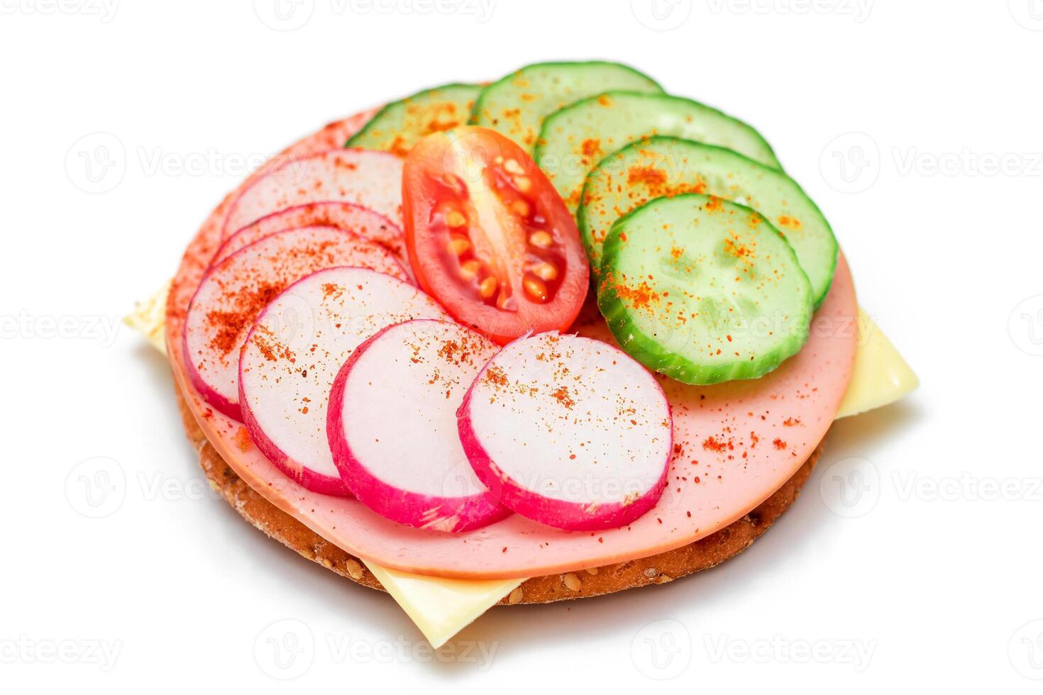 Crispy Cracker Sandwich with Fresh Cucumber, Cheese, Sausage, Radish and Tomato - Isolated on White. Quick and Healthy Sandwiches. Crispbread with Tasty Filling. Healthy Dietary Snack - Isolation photo