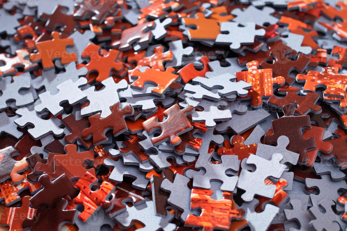 Top View of Mixed Pieces of a Jigsaw Puzzle - Texture Background photo