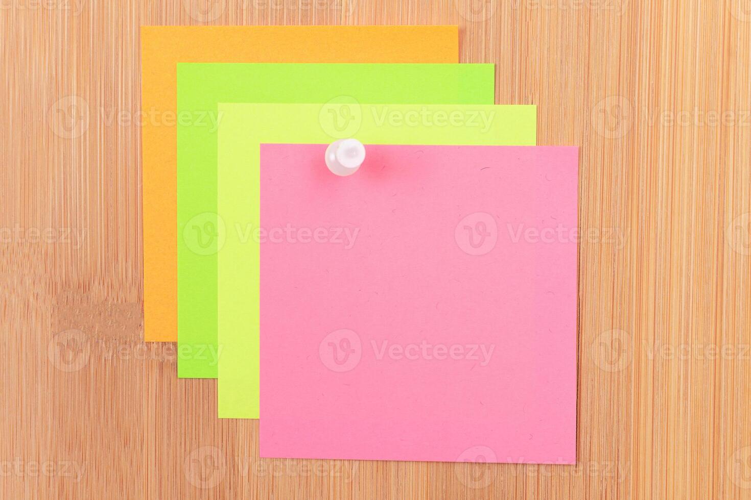 Colored Sticky Notes with Copyspace Pinned to the Wooden Message Board. To Do List Reminder in Office. Blank Memo Sticker at Work - Template. Empty Checklist - Mockup photo