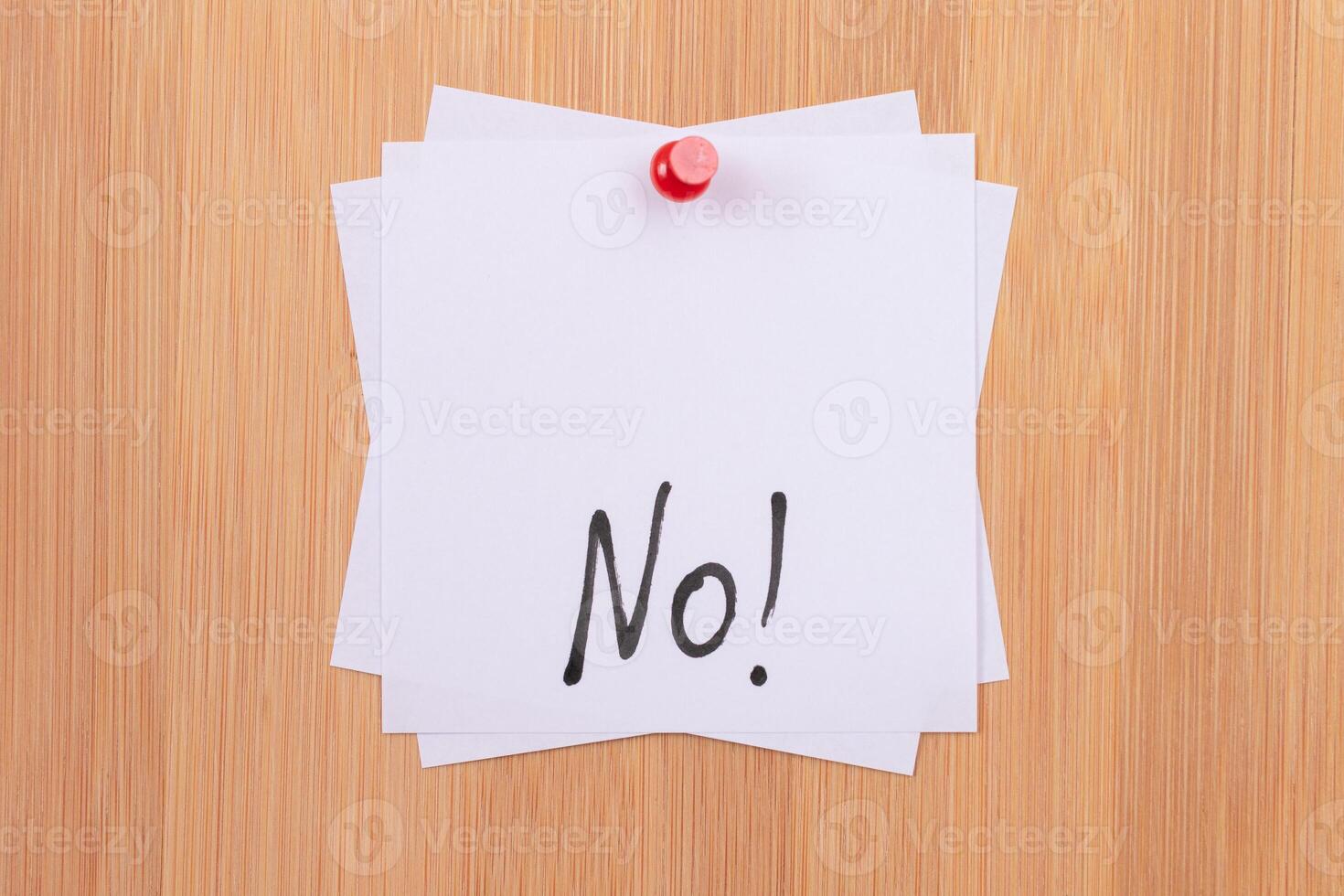NO - White Sticky Notes with Written Word NO, Pinned to the Wooden Message Board. To Do List Reminder in the Office. Memo Note at Work photo