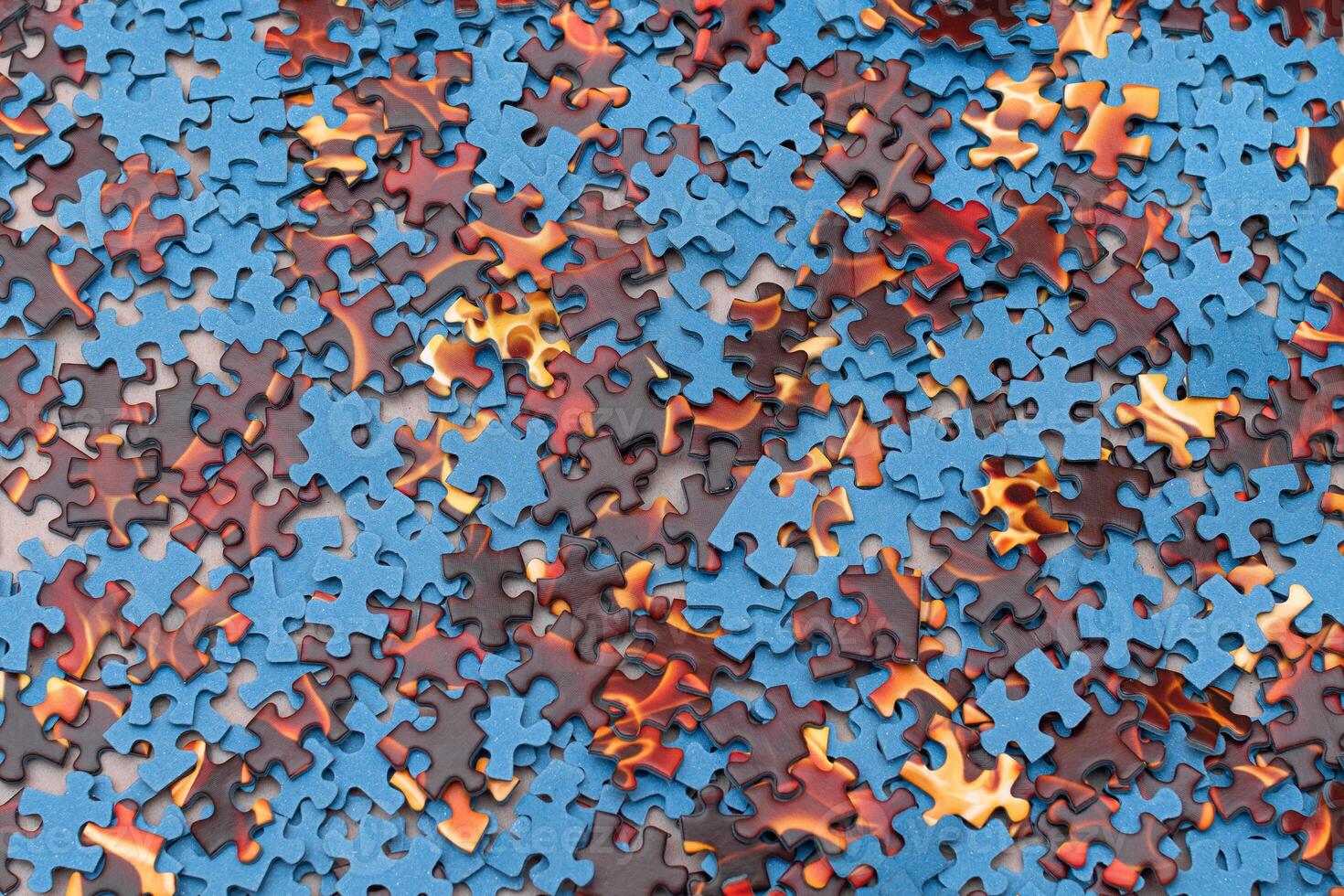 Top View of Mixed Pieces of a Jigsaw Puzzle - Texture Background photo