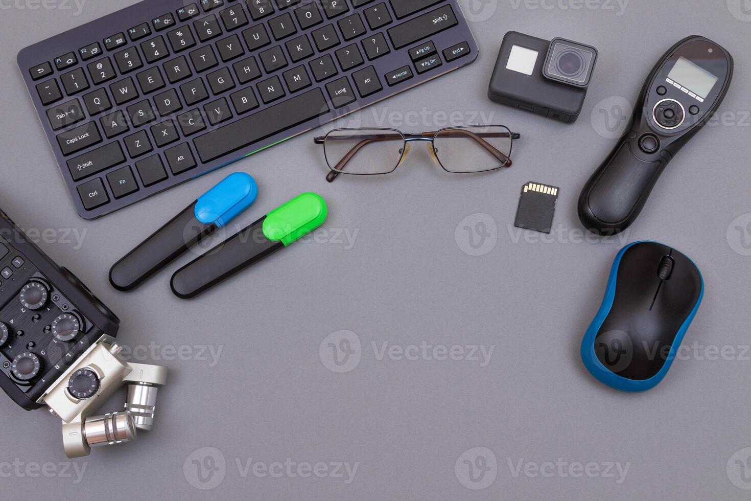 Top View of Blogger's Workplace. Digital Gadgets Lying on Grey Table - Flat Lay photo