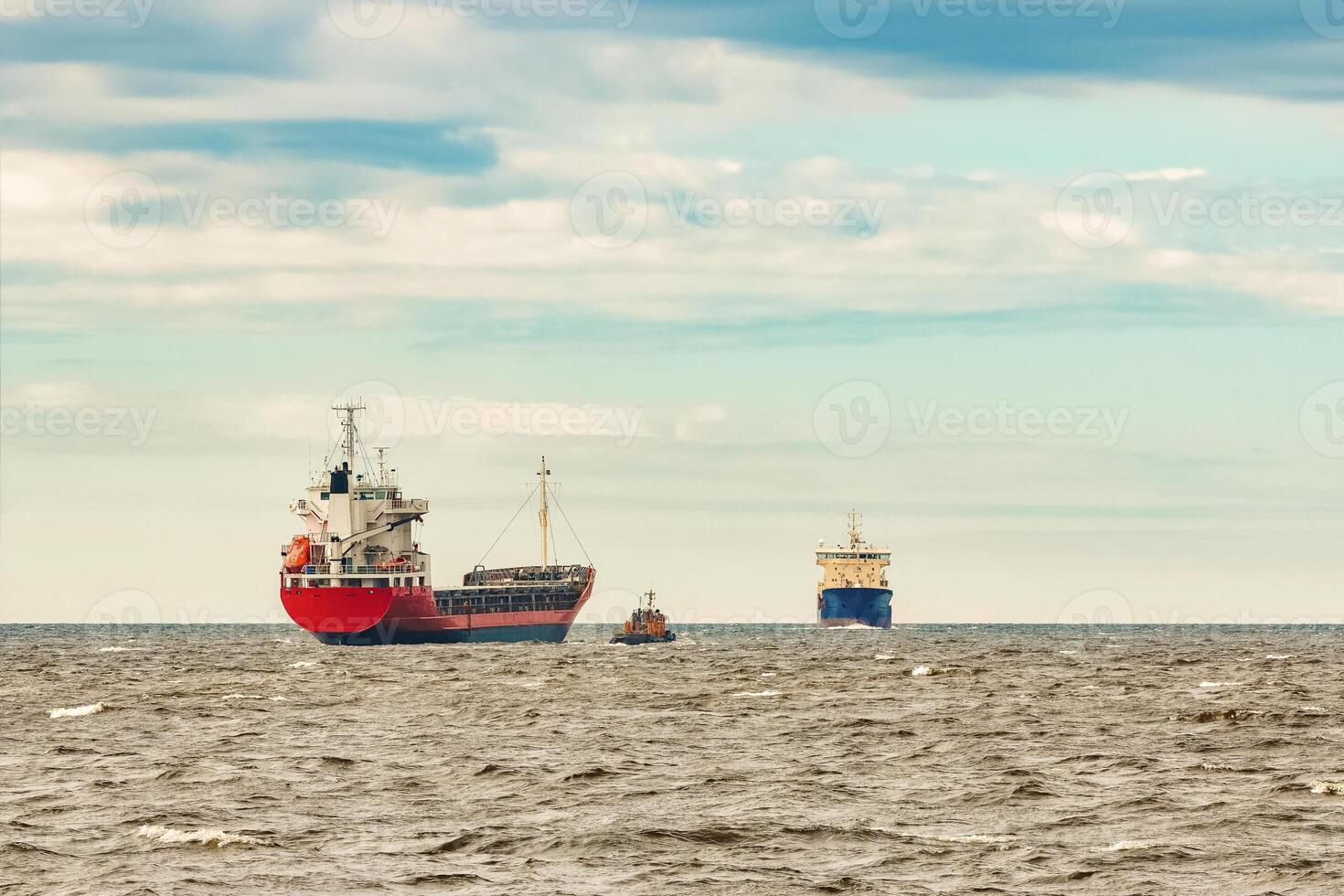 Red new cargo ship moving abroad. Product export in Europe photo