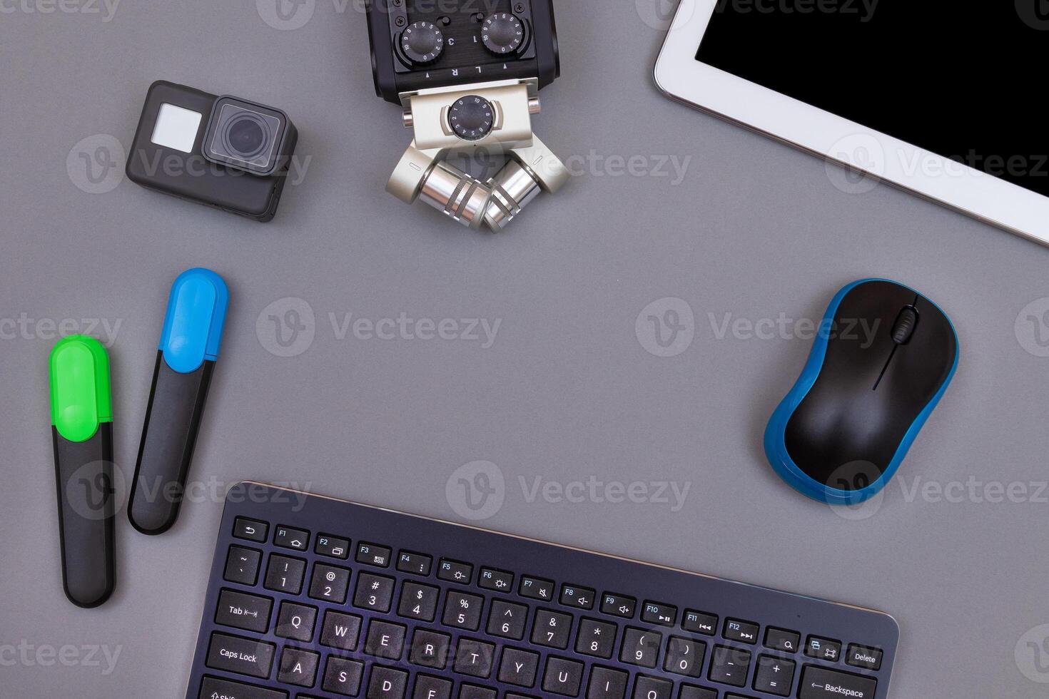 Top View of Blogger's Workplace. Digital Gadgets Lying on Grey Table - Flat Lay photo