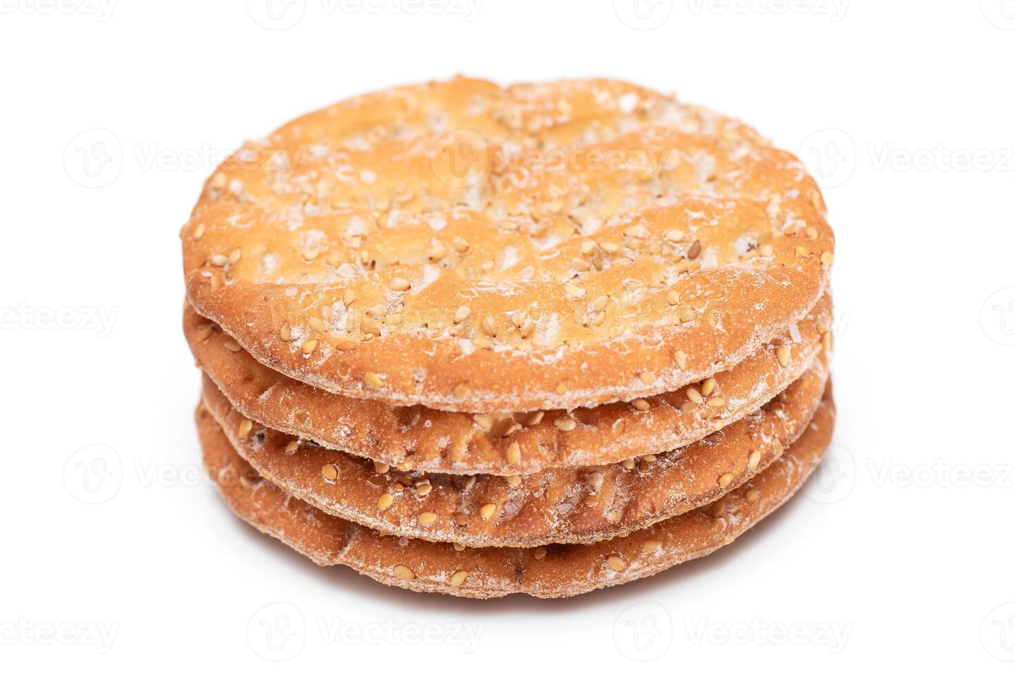 A Stack of Round Salt Crackers with Sesame Isolated on White Background. Dry Snacks - Isolation photo