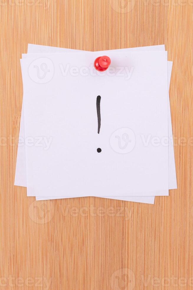White Sticky Notes with Exclamation Point Pinned to the Wooden Message Board. To Do List Reminder in the Office. Memo Note at Work photo