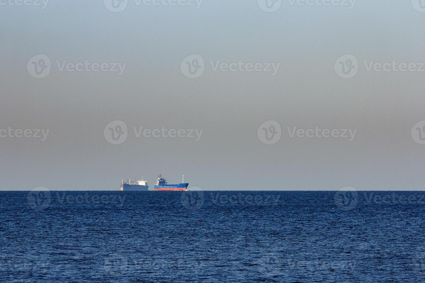 Blue cargo ship sailing from the Baltic sea photo