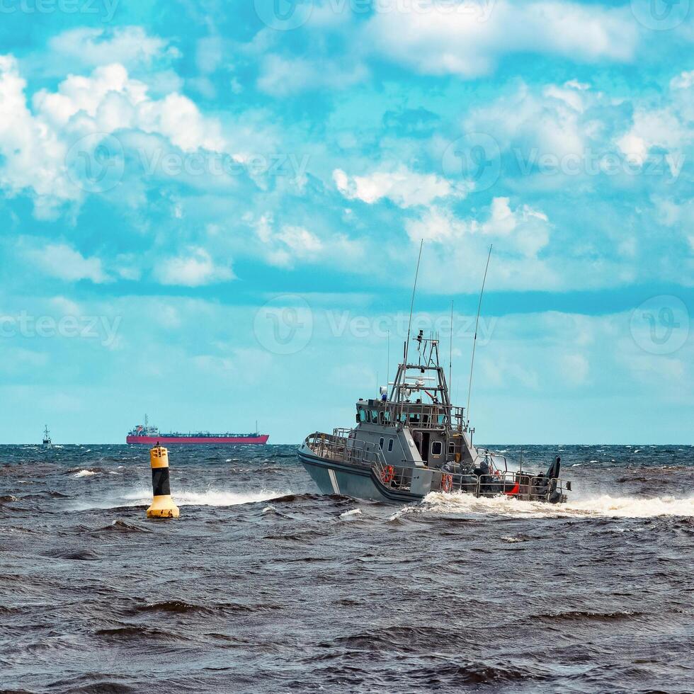 Grey military ship sailing at Baltic sea. Border guard service photo