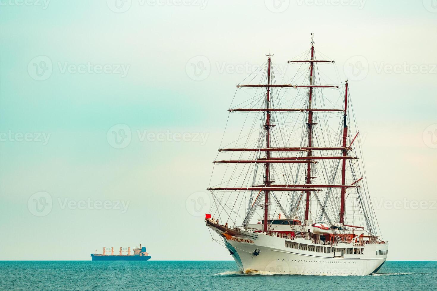 Big white sailing ship with three mast moving to the Riga port photo