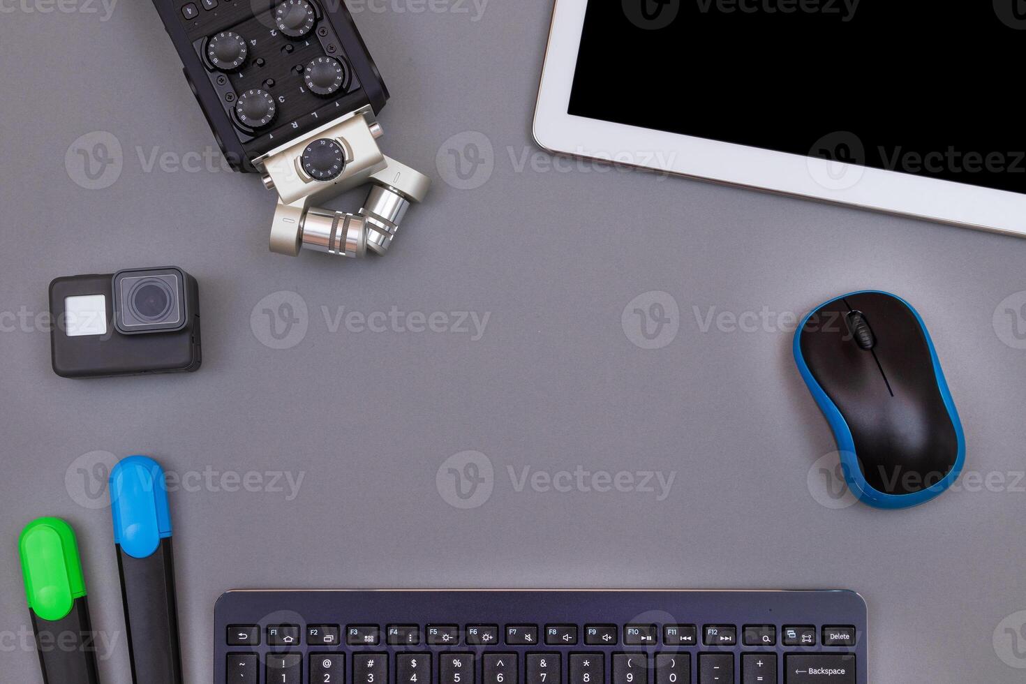 Top View of Blogger's Workplace. Digital Gadgets Lying on Grey Table - Flat Lay photo